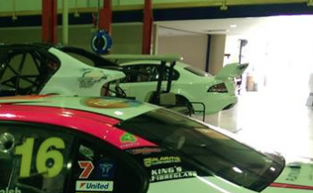 Ambrose's chassis sitting next to the team's spare and Scott Pye's race car at DJR last week