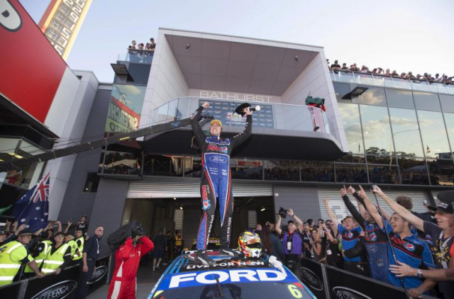 Chaz Mostert celebrates victory, scored alongside co-driver Paul Morris