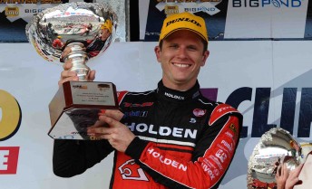 thumb Garth Tander proudly holds aloft his Race 6 trophy at the Clipsal 500
