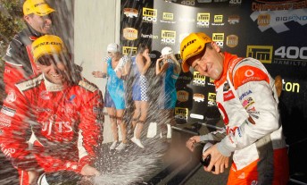thumb Garth Tander, Michael Caruso and Jamie Whincup celebrate on the ITM Hamilton 400 podium