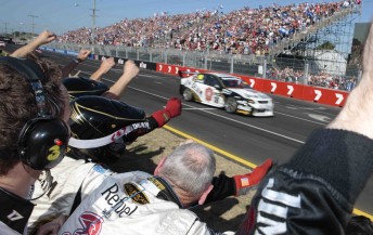 thumb James Courtney crosses the finish line to win Sunday's V8 race last year