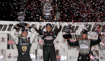 thumb Helio Castroneves celebrates victory in Kentucky alongside the Panther Racing pair of Ed Carpenter (left) and Dan Wheldon