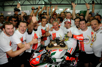 thumb Max Biaggi and the Aprilla team celebrate their world title