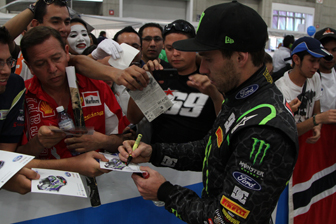 car Atko signs a few pieces of memorabilia for the fans