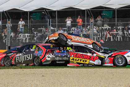 car Douglas' Commodore gets tipped on its side as the pack races around the carnage