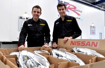 kellys Todd and Rick Kelly with a shipment of Nissan parts recently delivered to Kelly Racing's Braeside workshop