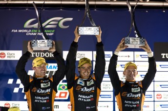 John Martin, Roman Rusinov and Mike Conway celebrate in Brazil