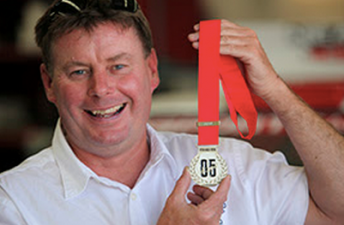 Neal Bates with the Peter Brock medal