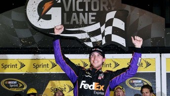 Denny Hamlin celebrates in Victory Lane