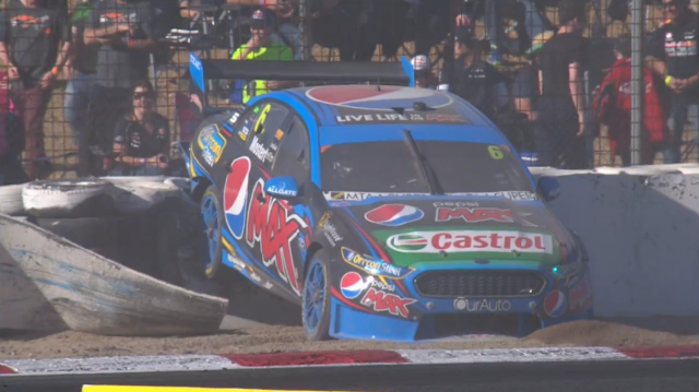 Chaz Mostert's Ford stranded on the Turn 4 tyre barrier in Race 12