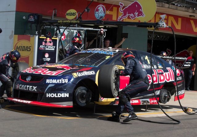 The Red Bull team cross-swapping tyres on Whincup's car in Race 15