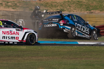 Todd Kelly's Altima survived this moment during the second qualifying heat
