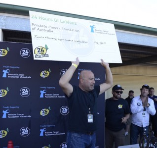 The inaugural 24 Hours of LeMons Oz raised almost $13,000 for prostate cancer research - cheque presented by Jay Lamm, founder of 24 Hours of LeMons events. pic: Wakefield Park Motorsport