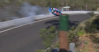 Mostert's car riding the wall before collecting the marshals' post